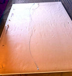 Reverse of the frame — older paper dust backing with age-related tears and discoloration; hanging wire fitted