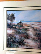 Close-up detail of the artwork — the lighthouse and sailboats on the water