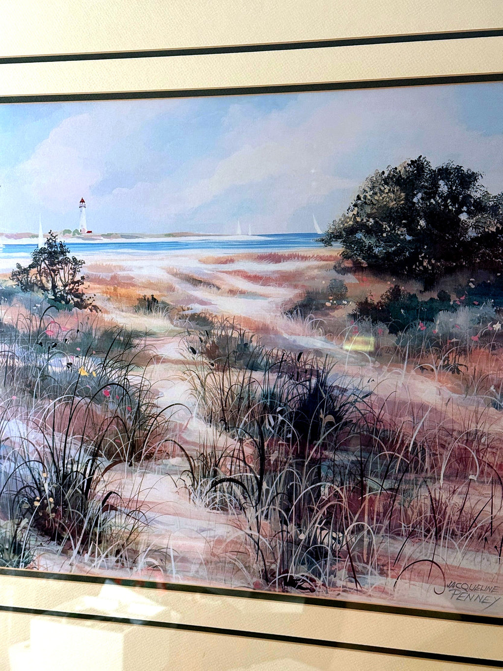 Close-up detail of the artwork — dune grasses, the winding sand path and the printed signature at lower right
