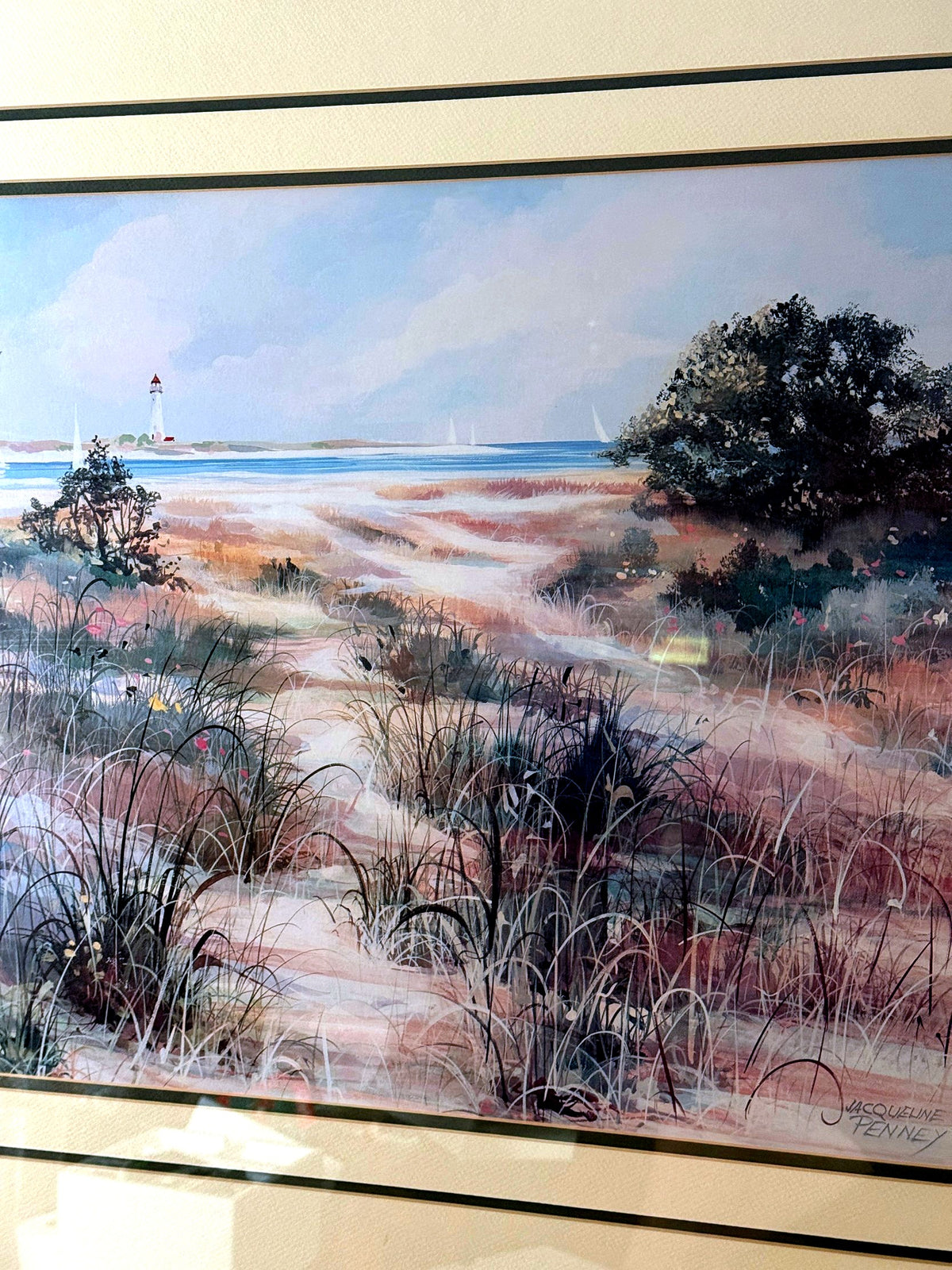 Close-up detail of the artwork — dune grasses, the winding sand path and the printed signature at lower right