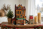 Department 56 Dickens' Village J. Lytes Coal Merchant on a console table with candles and wrapped gifts (styled display image for inspiration; the coal merchant building is the item for sale)