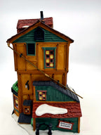 Department 56 Dickens' Village J. Lytes Coal Merchant, side view with the Deliveries Available shed and brass hoist rod