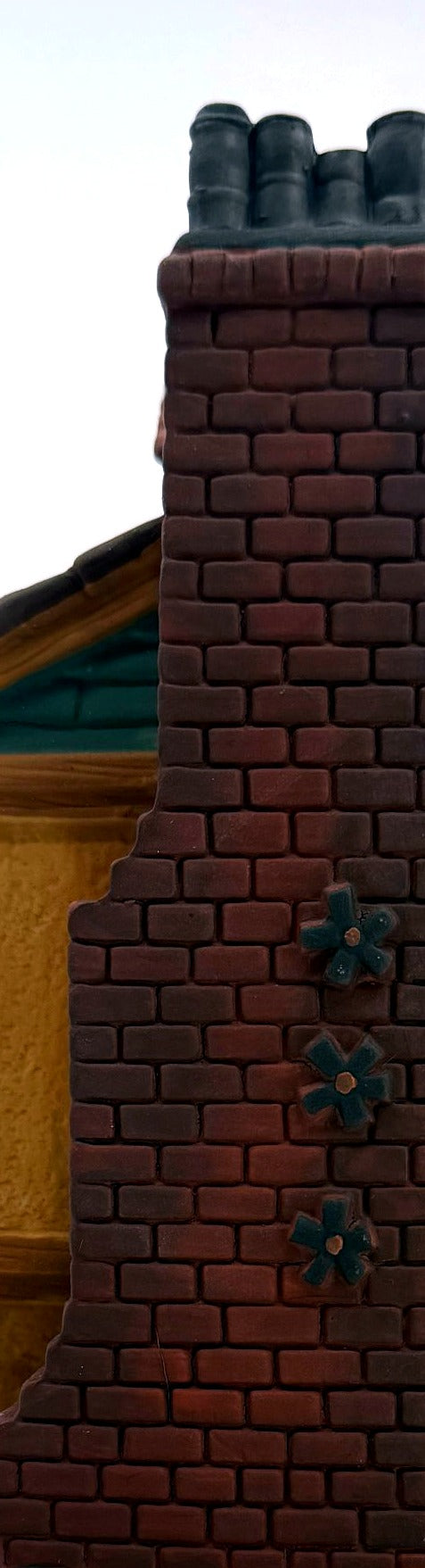 Close-up of the brick chimney with star-shaped tie plates
