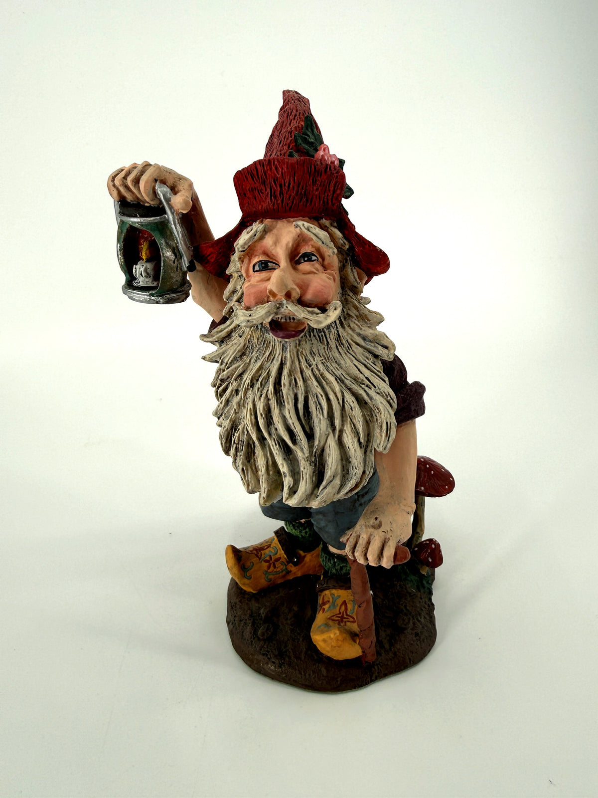 Julenisse close side-front view showing long white beard and lantern