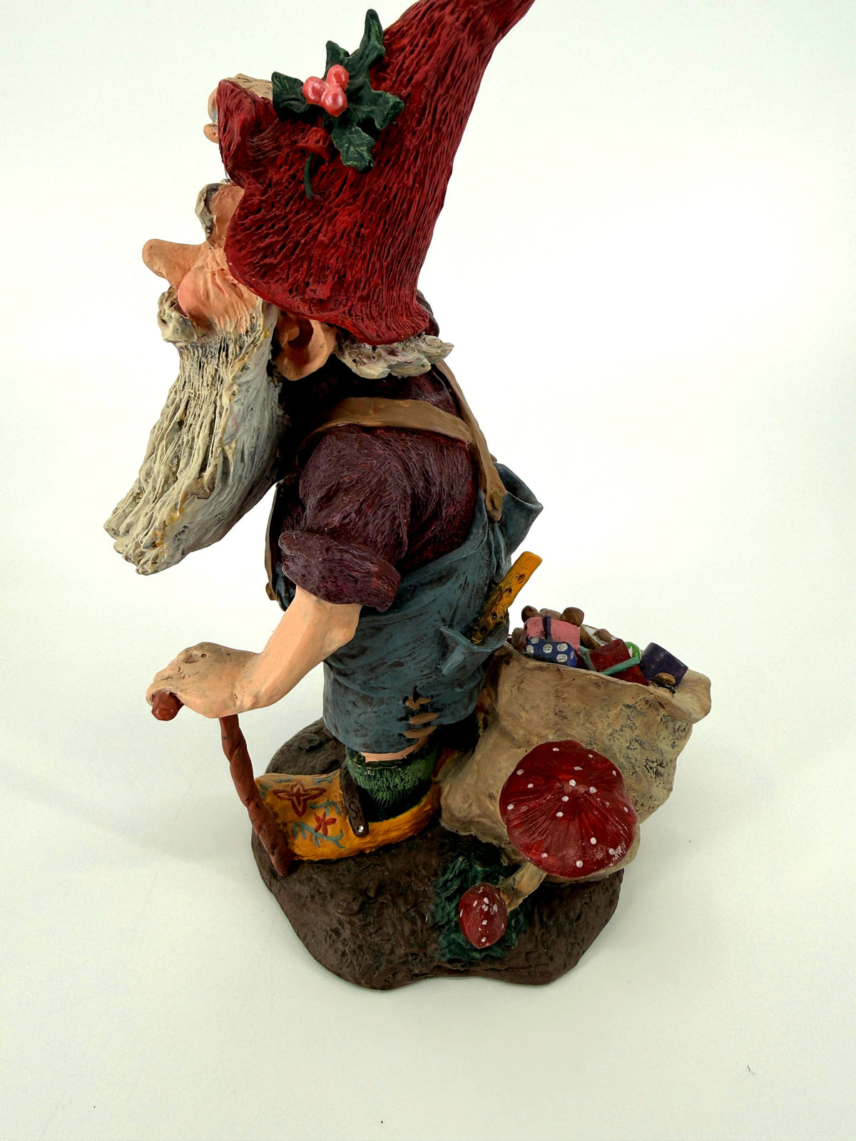 Julenisse side view with toy sack and red woodland mushrooms