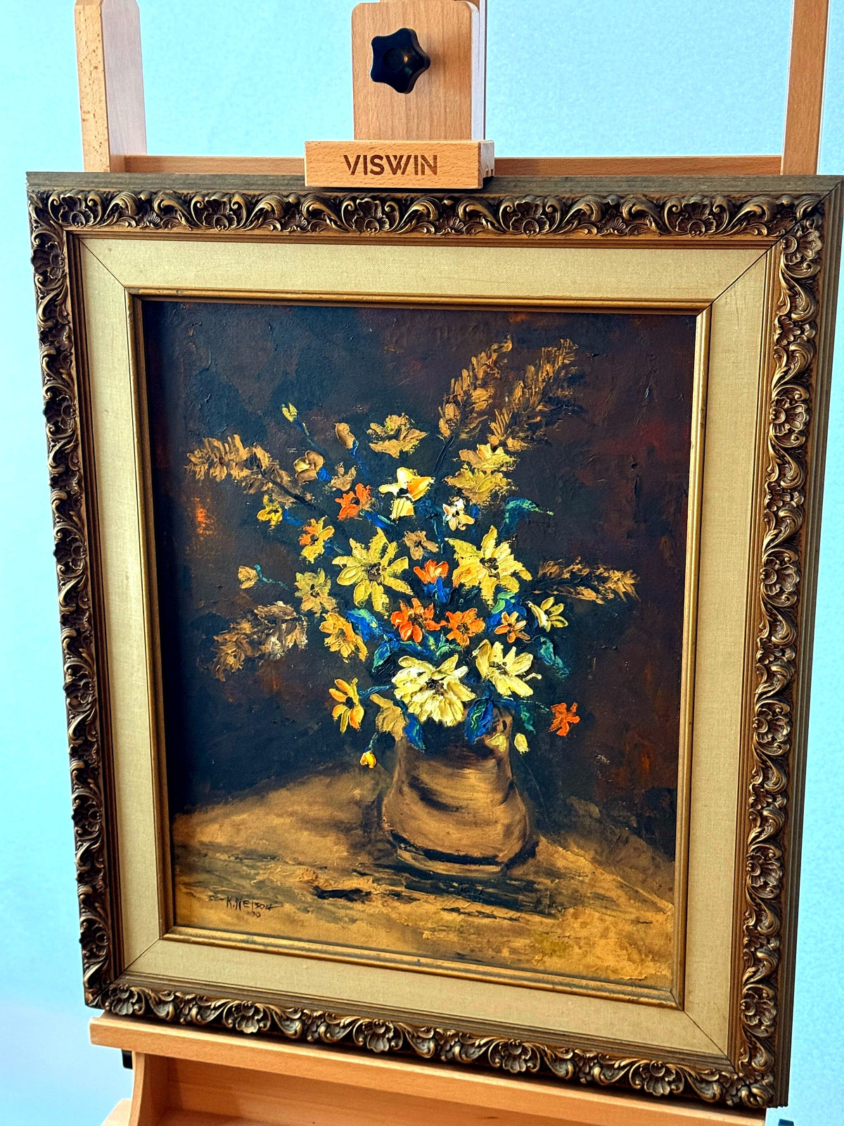 Vintage 1970 K. Nelson floral still life oil painting — front view from a slight angle on display easel