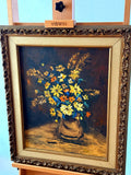 Vintage 1970 K. Nelson floral still life oil painting in ornate gold frame — front view on display easel