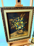Front view from the right angle on display easel, showing the ornate frame profile