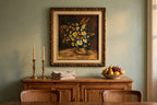 Styled lifestyle photo — the framed K. Nelson floral still life (22.5 × 26.5 in) above a buffet in a dining room (display inspiration)
