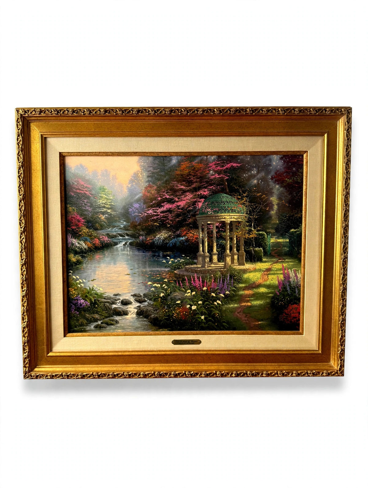 Thomas Kinkade The Garden of Prayer signed and numbered canvas 4438 of 4950 — front view on an easel