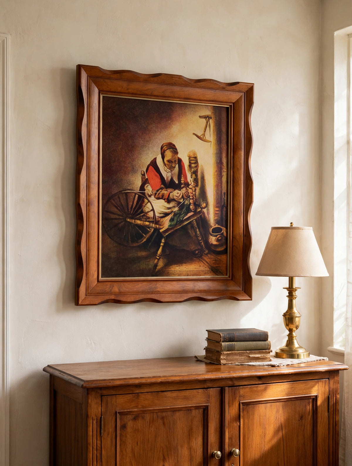 Styled lifestyle photo — the framed Nicolaes Maes “The Spinner” print above a wooden sideboard in a traditional living room (display inspiration)
