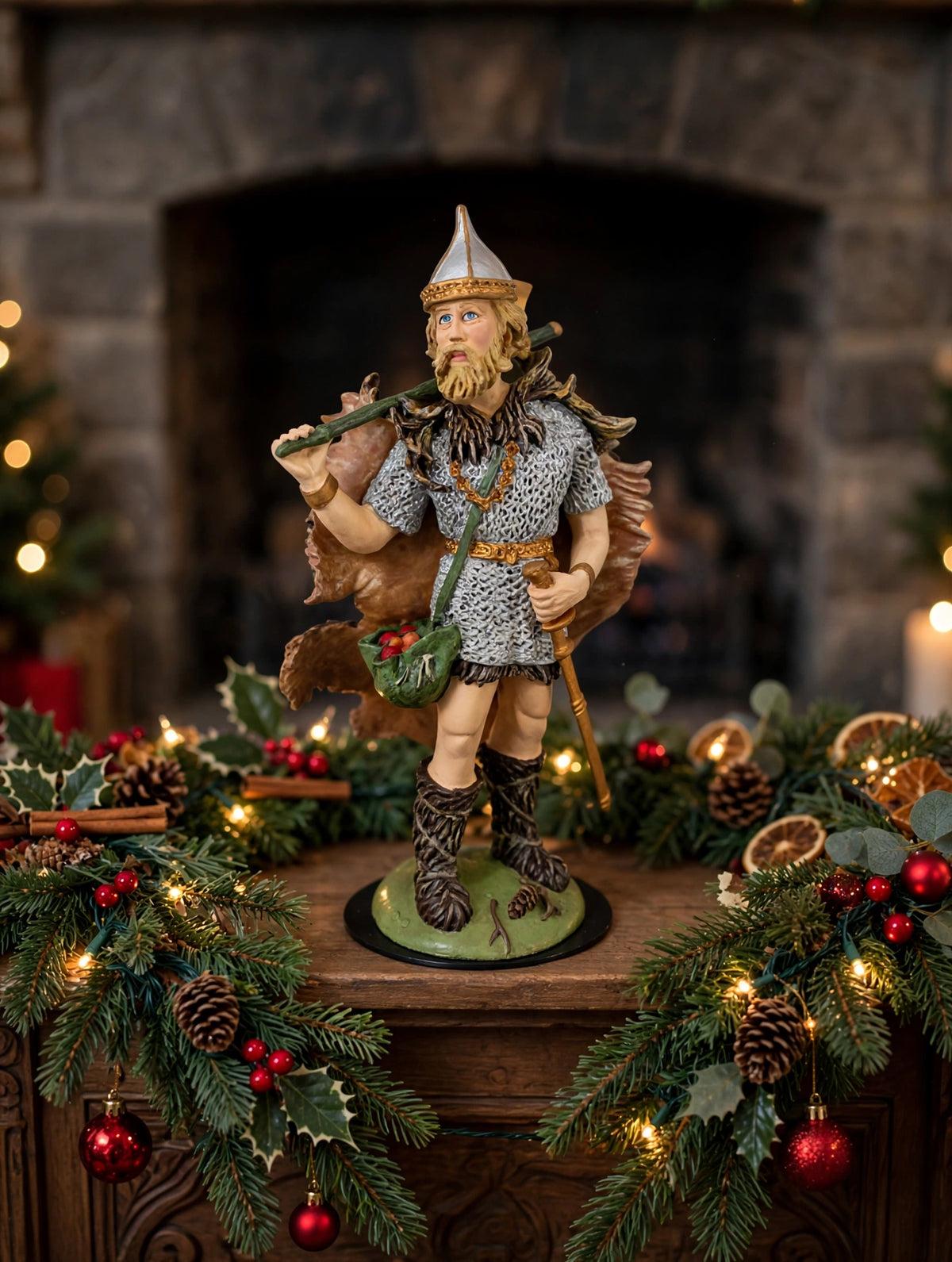 Odin displayed on a Christmas mantel with garland (styled display inspiration)