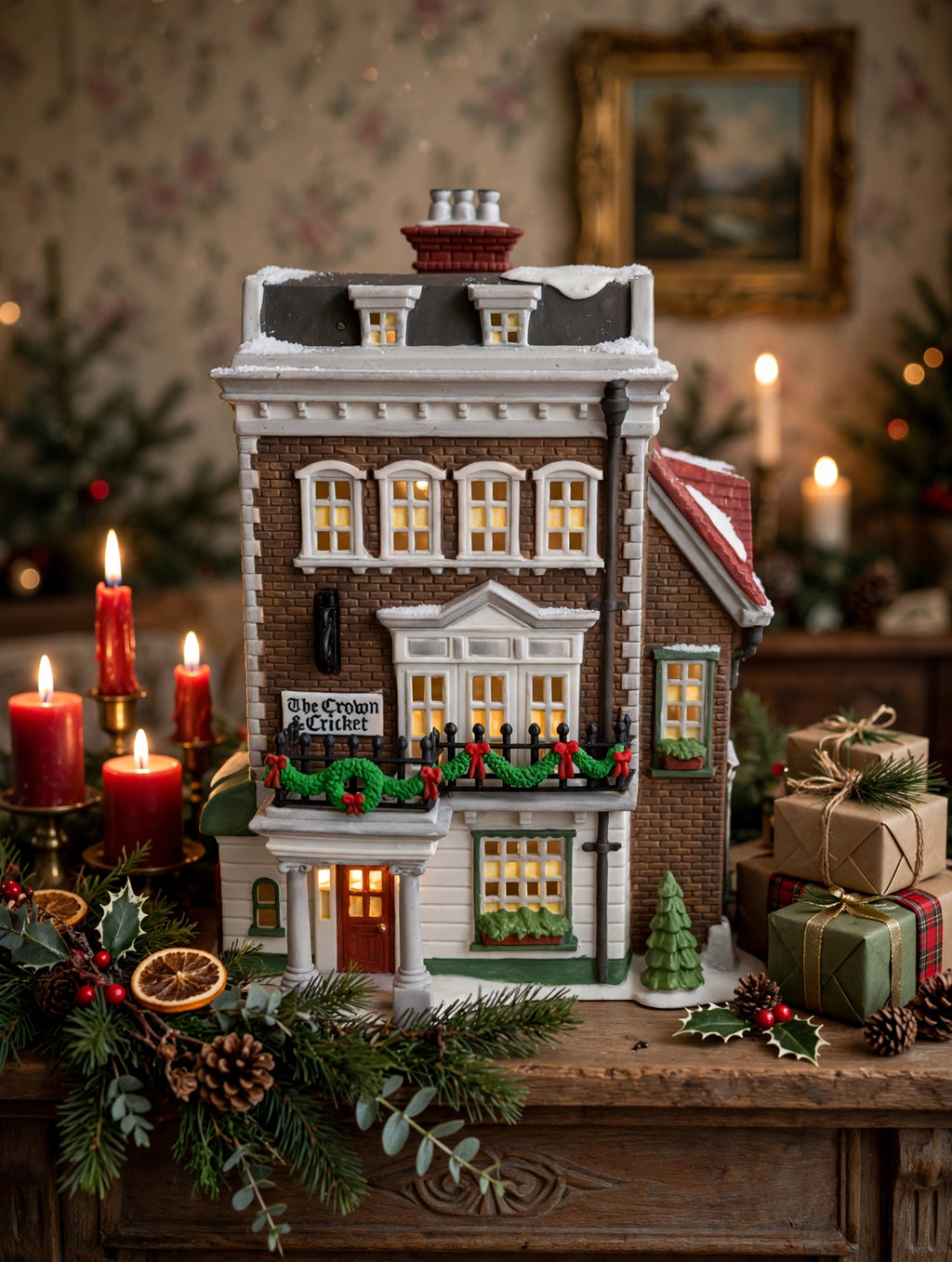 Department 56 Crown & Cricket Inn, Dickens' Village, 1992 First Edition on a Christmas mantel with candles and wrapped gifts (styled display inspiration)