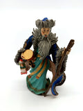 Duncan Royale Mongolian Santa figurine, front view with twisted staff, drum and dolls (enhanced)