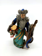Duncan Royale Mongolian Santa figurine, front view with twisted staff, drum and dolls (enhanced)