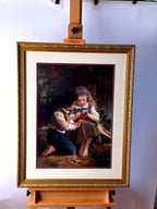 Emile Munier The Knitting Lesson framed art print — front view on an easel, wider shot