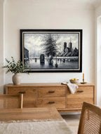 Styled lifestyle photo — the Paris Notre-Dame street scene oil hanging at true scale above a wooden sideboard in a bright dining room (styled display inspiration)