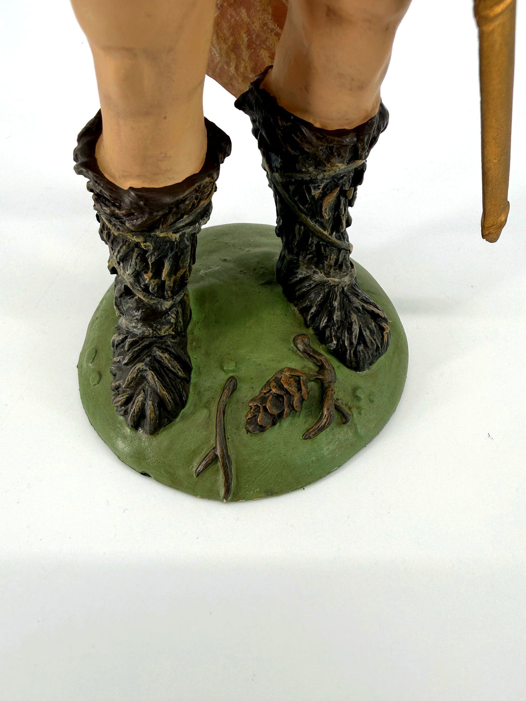 Detail: fur boots and base with pine cone (enhanced)