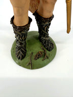 Detail: fur boots and base with pine cone (enhanced)