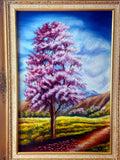 1985 signed oil on canvas pink flowering tree landscape, framed — front view of the painting