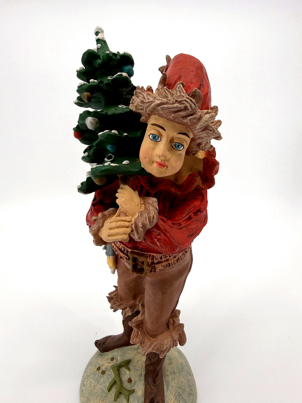 Duncan Royale The Pixie figurine, front view holding snow-dusted Christmas tree (enhanced)