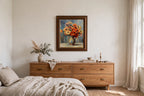 Styled lifestyle photo — the framed Renoir ‘Vase d’Anémones’ reproduction (25 × 30 in) above a wooden dresser in a serene bedroom (display inspiration)