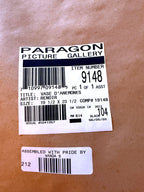 Paragon Picture Gallery Renoir Vase d'Anemones framed reproduction — close-up of the Paragon back label — item 9148, 'Vase d'Anemones', artist Renoir, 19.5 by 23.5, with the assembler's sticker