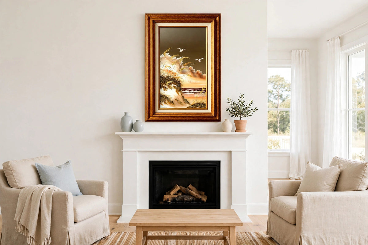 Styled lifestyle photo — the framed Ruby Melson mirror seascape above a white fireplace mantel in a bright coastal living room (display inspiration)