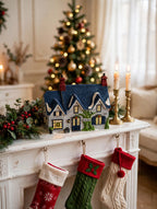 Styled lifestyle photo — Brownlow House on a fireplace mantel with garland, candles and stockings (display inspiration)