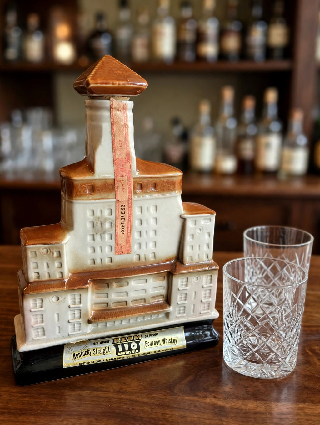 Styled display inspiration: the Broadmoor decanter on a home bar counter beside cut-glass rocks tumblers