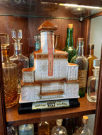 Styled display inspiration: the Broadmoor decanter on a shelf in a glass-front decanter cabinet