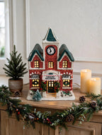 Valley Railways station styled on an entry console with a potted evergreen and candles — styled scene, display inspiration only (enhanced photo)