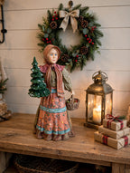 Babouska displayed on an entryway console beneath a wreath with a lantern (styled display inspiration)