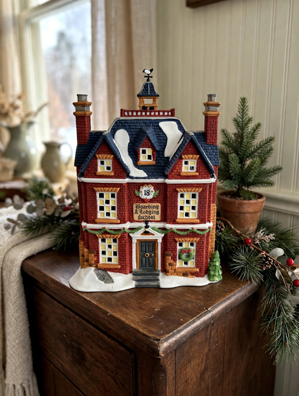 Department 56 Dickens' Village Boarding & Lodging School 1993 #5809-2 – 150th Anniversary of A Christmas Carol Commemorative Edition, No. 18 – styled display inspiration: shown on a wooden sideboard in a vintage home interior