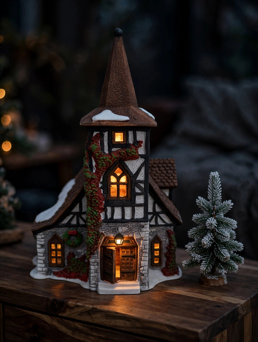 Department 56 Dickens' Village Old Michaelchurch 1992 lighted porcelain church — styled scene: lit from within at dusk beside a frosted miniature pine (display inspiration)