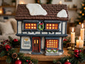 Department 56 Tutbury Printer, Dickens' Village, 1990 – shown on a Christmas mantel with candles and garland (styled display inspiration)