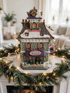 Williamson's Garden Shoppe styled on a Christmas mantel with garland and string lights — styled scene, display inspiration only (enhanced photo)