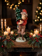 The Pixie displayed on a Christmas fireplace mantel with garland and candles (styled display inspiration)