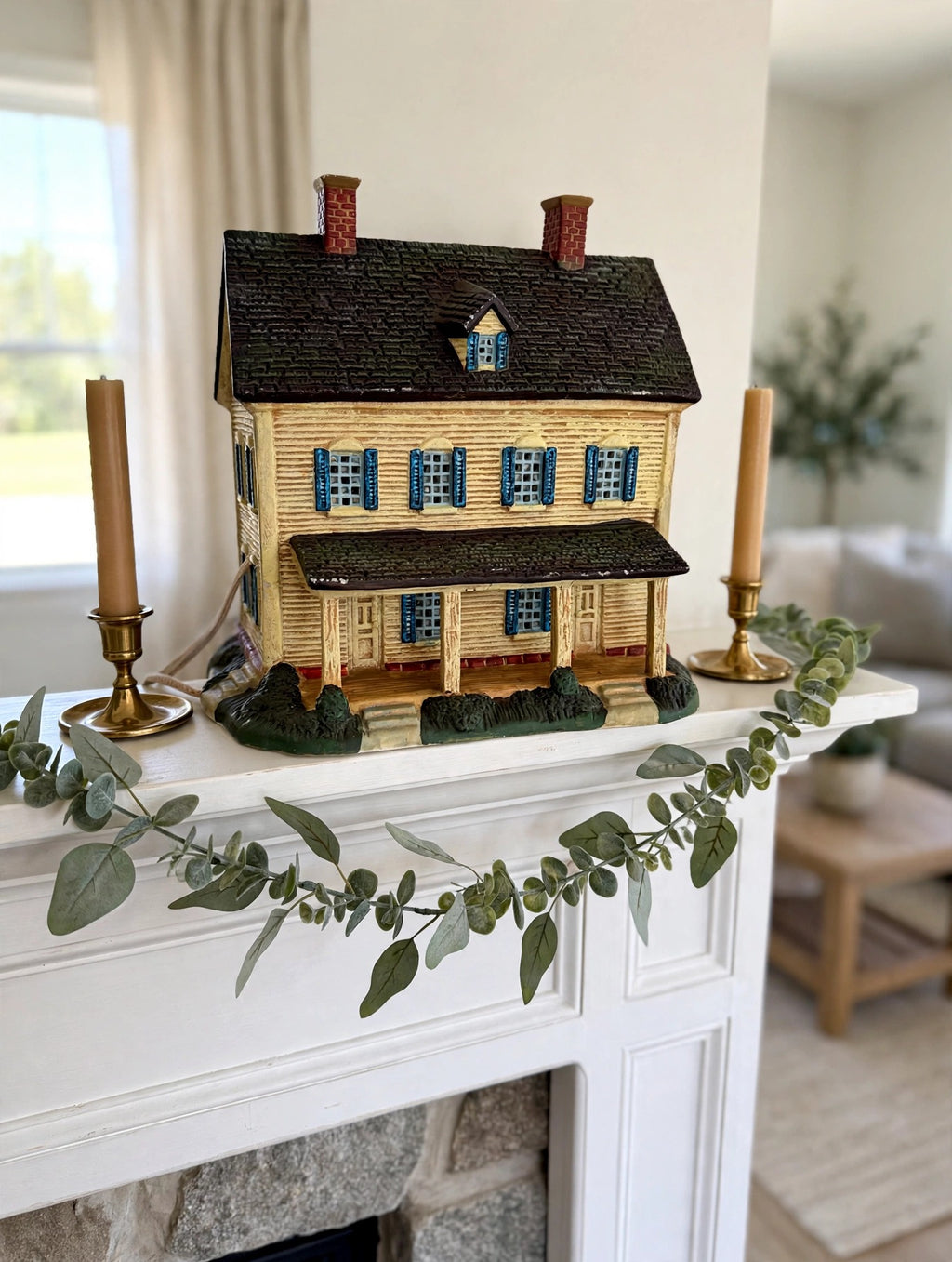 Meadowbrook Farm House styled on a fireplace mantel with brass candlesticks — display inspiration