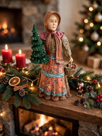 Babouska displayed on a Christmas fireplace mantel with garland and candles (styled display inspiration)