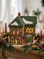 Department 56 Dickens' Village T. Puddlewick Spectacle Shop #58334 — styled scene: lit on a Christmas mantel with garland and red candles (display inspiration)
