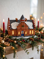 Hawthorne The Town Offices Norman Rockwell Christmas in Stockbridge 1993 — styled scene: lit on a Christmas mantel with garland and red candles (display inspiration)