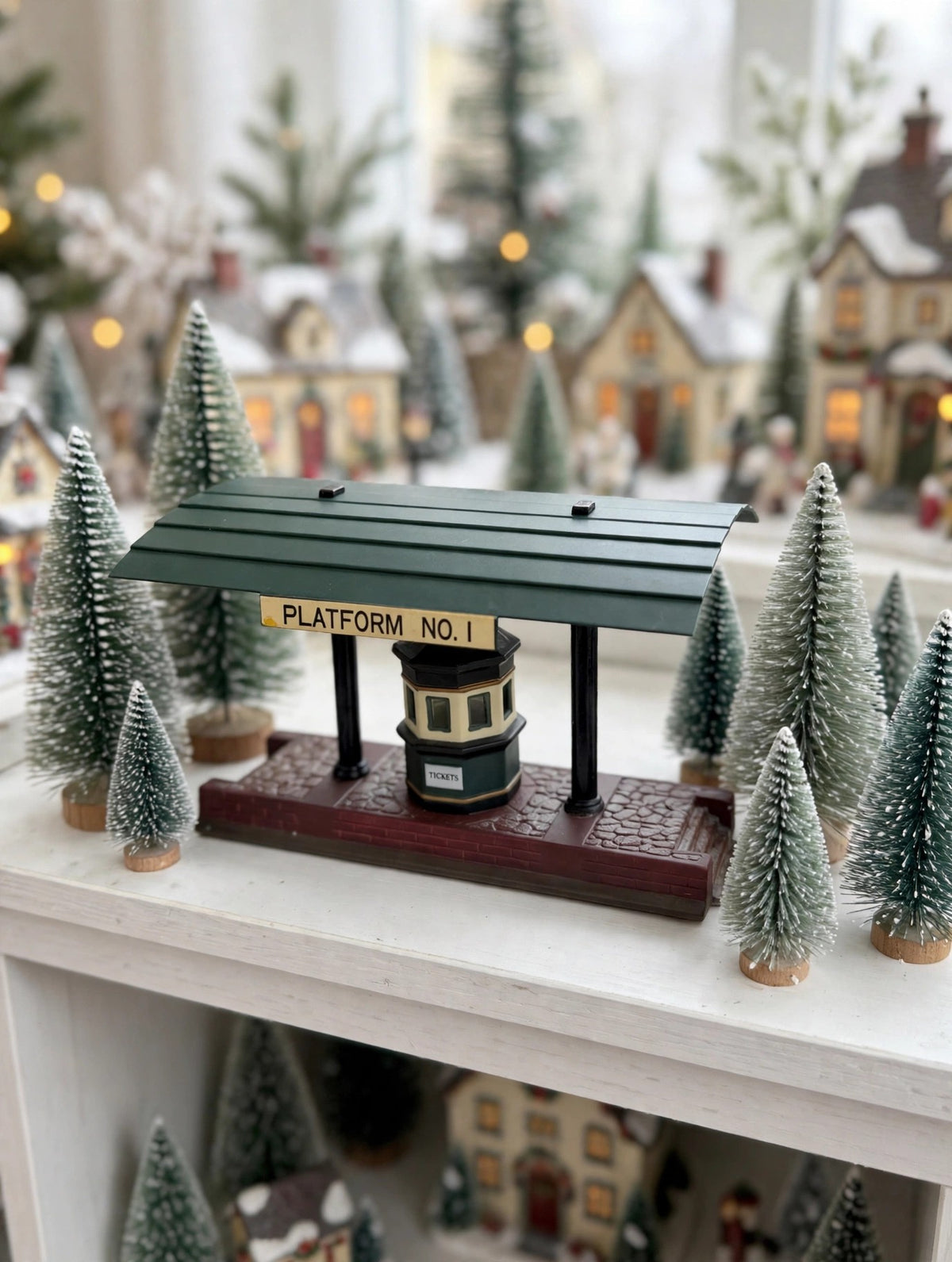 Victoria Station Train Platform styled in a Christmas village shelf display with bottle-brush trees — styled scene, display inspiration only (enhanced photo)