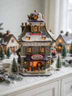 Williamson's Garden Shoppe in a Christmas village row on a snowy sideboard — styled scene, display inspiration only (enhanced photo)