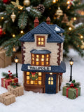 Department 56 Dickens' Village Walpole Tailors #5926-9 — styled scene: lit under a Christmas tree with miniature lamp posts and gifts (display inspiration)