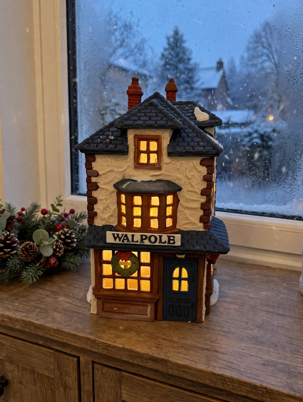 Department 56 Dickens' Village Walpole Tailors #5926-9 — styled scene: lit on a wooden sideboard by a frosted window at dusk (display inspiration)