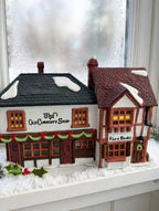 Department 56 Dickens' Village The Old Curiosity Shop #5905-6 — styled snowy window display (display inspiration)