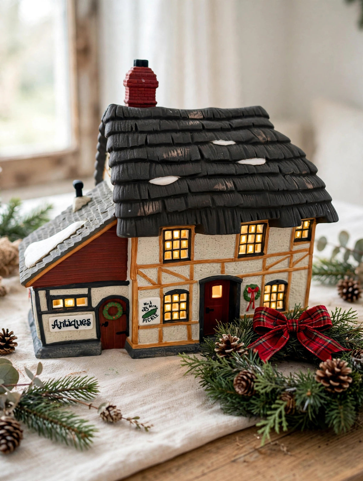 Styled photo - Mr. & Mrs. Pickle Cottage on a holiday table with wreath (display inspiration)