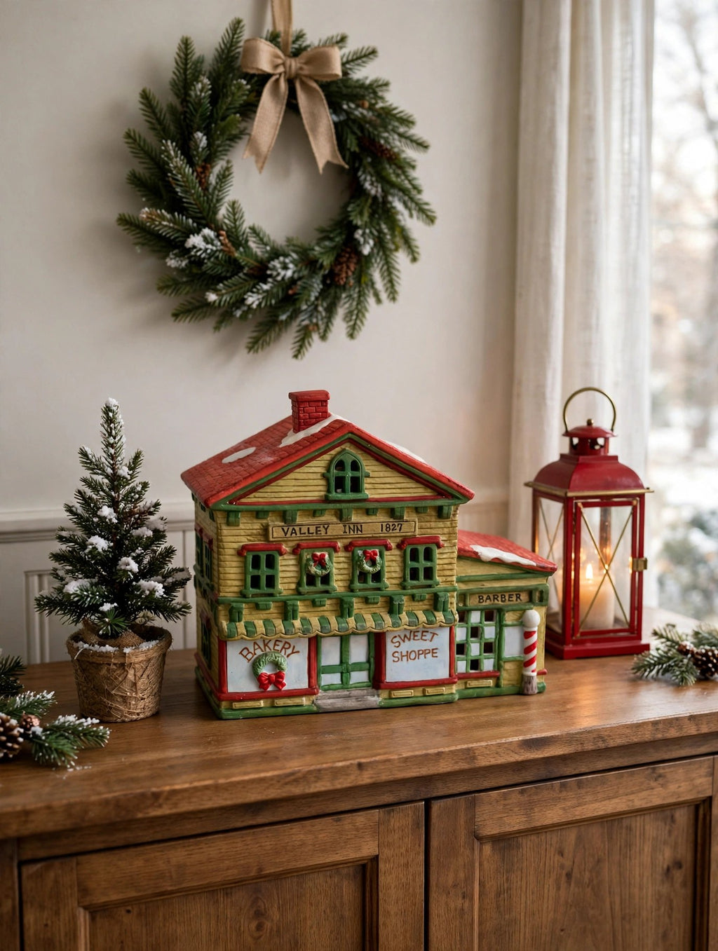 Sweet Shoppe and Bakery on an entryway console with a wreath and lantern - styled display inspiration