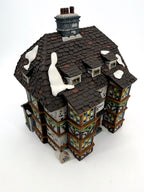 Sir John Falstaff Inn three-quarter front view — half-timbered façade, bay windows and snow-covered slate roof